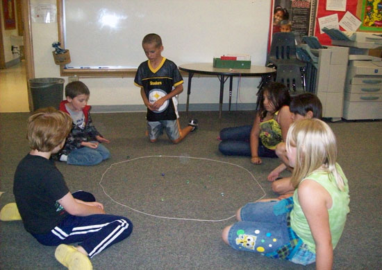 Learning to Play Marbles
